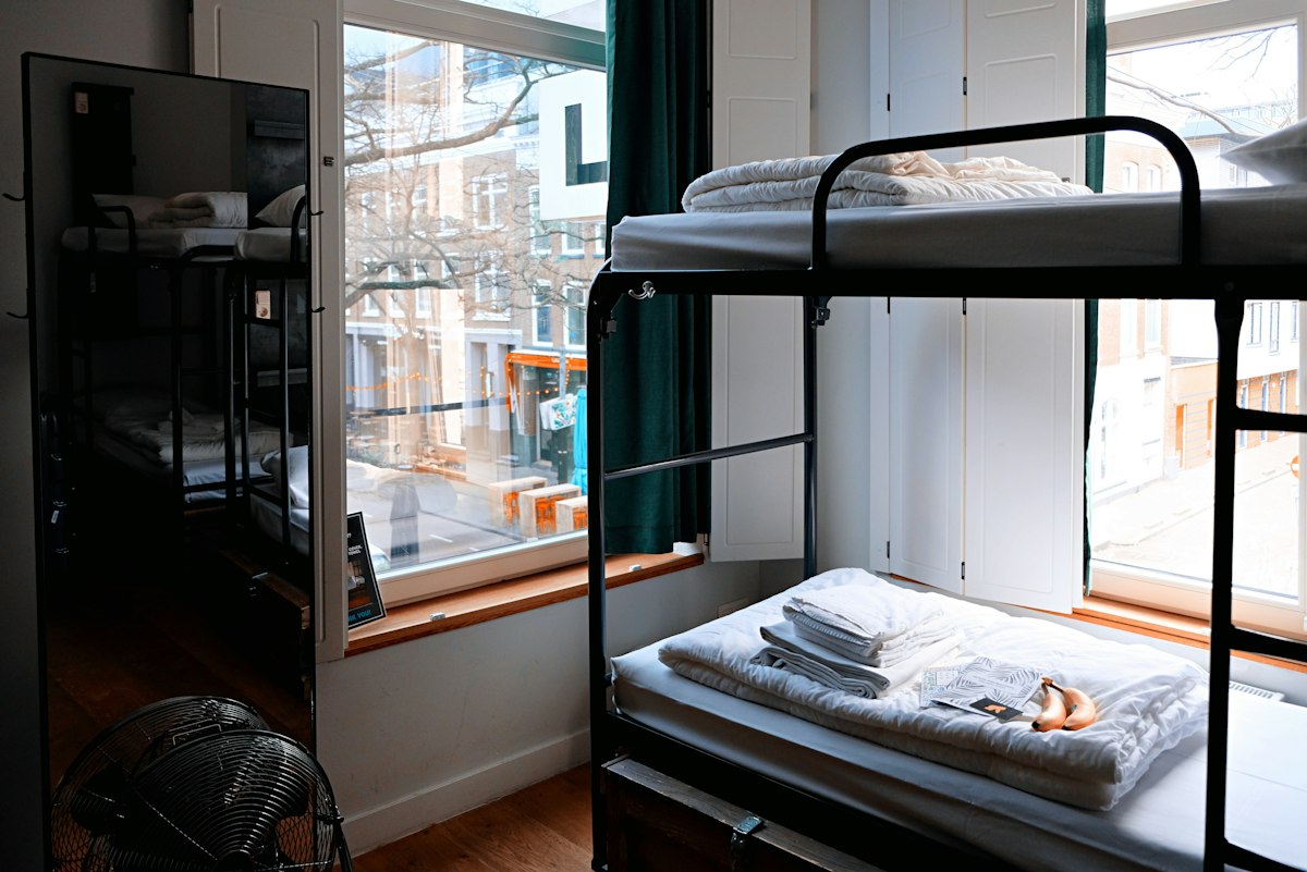 Bright hostel room with bunk beds
